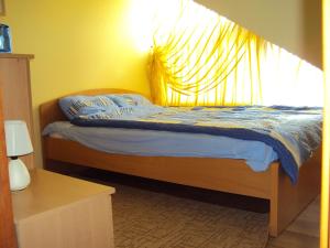 a bedroom with a bed with a large window at Rowy, Słoneczne plaże in Rowy