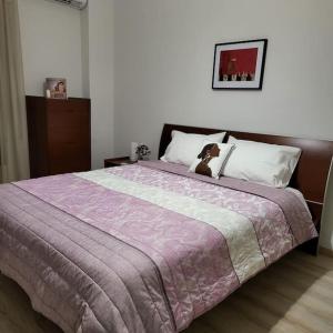A bed or beds in a room at BEAUTIFUL APARTMENT IN VERIA