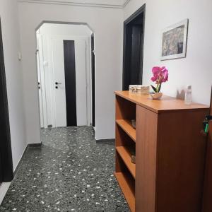a room with a hallway with a dresser and a door at BEAUTIFUL APARTMENT IN VERIA in Veria