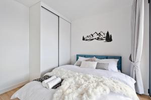 Łóżko lub łóżka w pokoju w obiekcie Apartament Morskie Oko Odkryj Zakopane