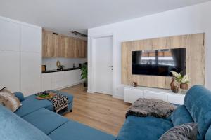 Telewizja i/lub zestaw kina domowego w obiekcie Apartament Morskie Oko Odkryj Zakopane