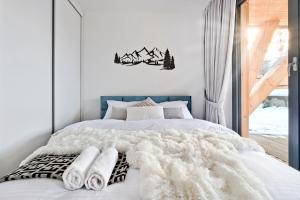 Łóżko lub łóżka w pokoju w obiekcie Apartament Morskie Oko Odkryj Zakopane