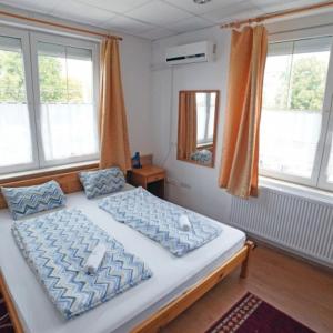 Letto o letti in una camera di Balaton Vendégház Fonyód