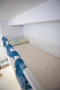 A bed or beds in a room at La Casa di Orimari
