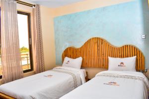 Posteľ alebo postele v izbe v ubytovaní Breeze Hotel Nyahururu