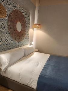 מיטה או מיטות בחדר ב-Soho Boutique Cádiz