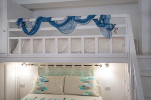 Säng eller sängar i ett rum på La Casa di Orimari