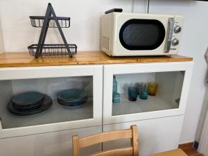 A kitchen or kitchenette at La Casa di Orimari