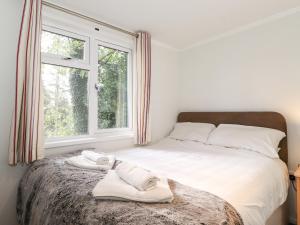 Un pat sau paturi într-o cameră la Treetops