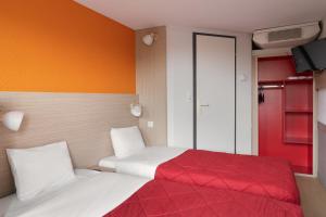 Postel nebo postele na pokoji v ubytování Hotel Fleury Merogis - Ex Premiere Classe Fleury Merogis