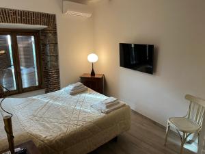 Postel nebo postele na pokoji v ubytování Albergo Diffuso Locanda Specchio Di Diana