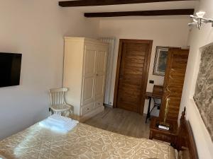 Postel nebo postele na pokoji v ubytování Albergo Diffuso Locanda Specchio Di Diana