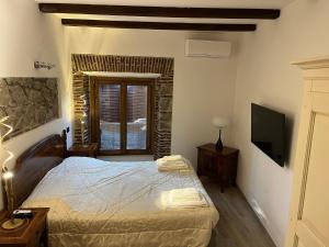 Postel nebo postele na pokoji v ubytování Albergo Diffuso Locanda Specchio Di Diana