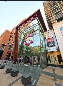 a building with a sign on the side of it at Feel Home DeLuxe CORVIN # FREE PARKING # AC # Elevator in Budapest