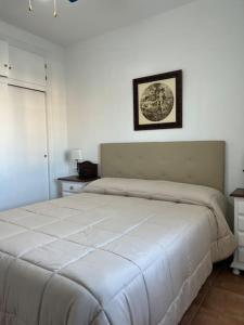 A bed or beds in a room at Casa duplex en chipiona