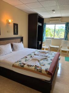 Postel nebo postele na pokoji v ubytování RT KhaoLak Hotel