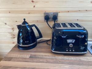 a toaster and a toaster sitting on a counter at Laity's Lodge in Penzance