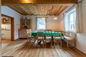 a kitchen and dining room with a table and chairs at Das Haus in Altaussee in Altaussee
