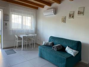 a living room with a couch and a table at Casa São Domingos in Salir de Matos