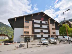 a building with cars parked in front of it at Chevruls A14 in Morzine +6 photos