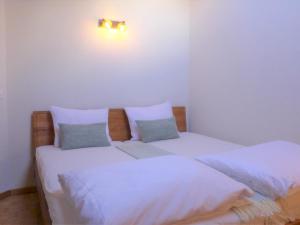 Postel nebo postele na pokoji v ubytování Apartment Arbgrat by Interhome