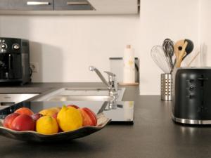 a bowl of fruit on a counter in a kitchen at Apartment Haus Stock by Interhome in Tux