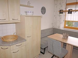 a kitchen with a table and a counter top at Apartment Schlatter by Interhome in Alterzoll