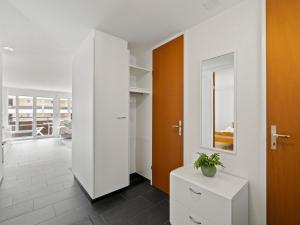 een kamer met een witte kast met een plant erop bij Apartment Nr-05 Haus Sursilvana by Interhome in Lenzerheide