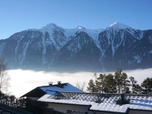 a view of a mountain range with snow covered mountains at Holiday Home Plattner-2 by Interhome in Oetz