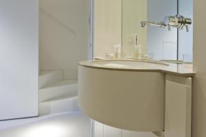 a bathroom with a sink and a mirror at Suitime in Milan +29 photos