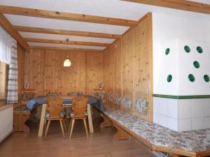 a dining room with a table and two chairs at Holiday Home Plattner-2 by Interhome in Oetz +20 photos