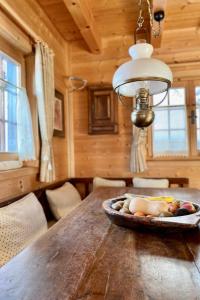 a dining room table with a bowl of fruit on it at Chalet Chalet Rodas 9 by Interhome in Malmigiuer
