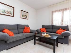 a living room with two couches and a coffee table at Villa Villa Tello by Interhome in L'Ametlla de Mar