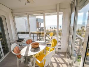 a dining room with a table and chairs at Apartment Formentor by Interhome in Salou