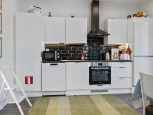 A kitchen or kitchenette at Holiday Home Lepoloma by Interhome