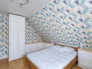 Łóżko lub łóżka w pokoju w obiekcie Holiday Home La Perle by Interhome