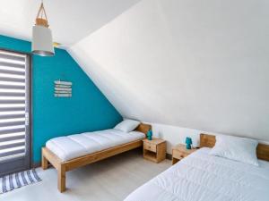 Łóżko lub łóżka w pokoju w obiekcie Holiday Home La Perle by Interhome