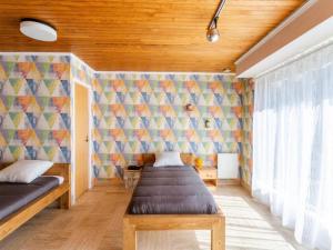 Łóżko lub łóżka w pokoju w obiekcie Holiday Home La Perle by Interhome