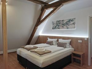 En eller flere senger på et rom på Lebererhof Apartments - XL2