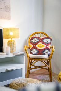 a chair with a pillow sitting next to a desk at No. 7 Olhão in Olhão