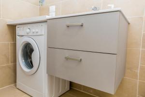 a white washer and dryer in a bathroom at MareVasto - appartamento Vasto Marina in Vasto
