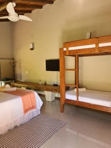 Cama ou camas em um quarto em Pousada Maritacas do Sana