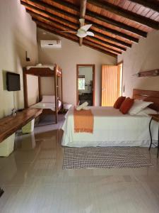 Cama ou camas em um quarto em Pousada Maritacas do Sana