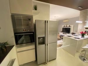 Kuchyňa alebo kuchynka v ubytovaní Renko Apartman