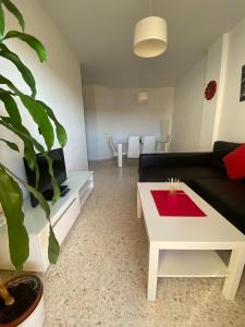 a living room with a couch and a coffee table at Apartamento en Jerez de la Frontera in Jerez de la Frontera