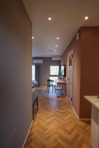 a hallway with a kitchen and a dining room at ZDT-613 in Tokyo