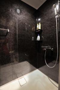 a bathroom with a shower with a glass door at ZDT-613 in Tokyo