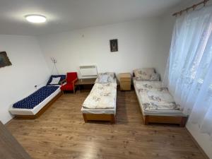 A bed or beds in a room at Sajó Vendégház