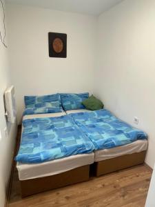 A bed or beds in a room at Sajó Vendégház