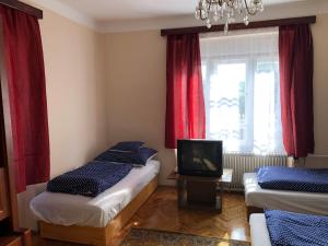 A bed or beds in a room at Sajó Vendégház
